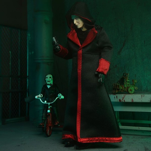 SAW (FRANCHISE) - 7" SCHAAL ACTIEFIGUUR - ULTIMATE JIGSAW KILLER (BLACK ROBE)