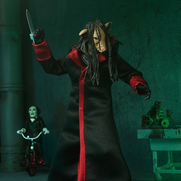 SAW (FRANCHISE) - 7" SCHAAL ACTIEFIGUUR - ULTIMATE JIGSAW KILLER (BLACK ROBE)