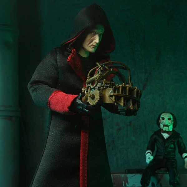 SAW (FRANCHISE) - 7" SCHAAL ACTIEFIGUUR - ULTIMATE JIGSAW KILLER (BLACK ROBE)
