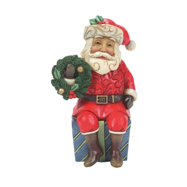 DE KERSTMAN ZIT OP EEN GESCHENK - JIM SHORE HEARTWOOD CREEK