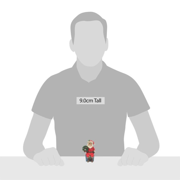 DE KERSTMAN ZIT OP EEN GESCHENK - JIM SHORE HEARTWOOD CREEK